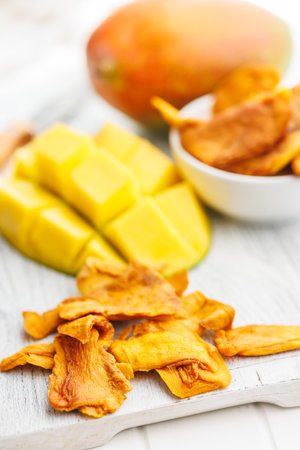 Dried mango fruit on the white table.の写真素材