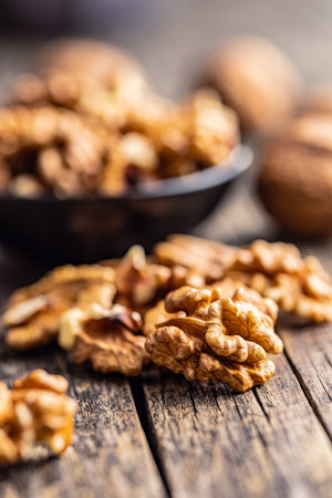 Peeled dried walnut kernels on the wooden table.の写真素材