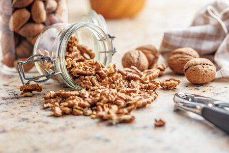 Peeled dried walnut kernels in the jar.の写真素材