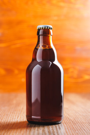 Bottle of beer on the wooden table.の写真素材