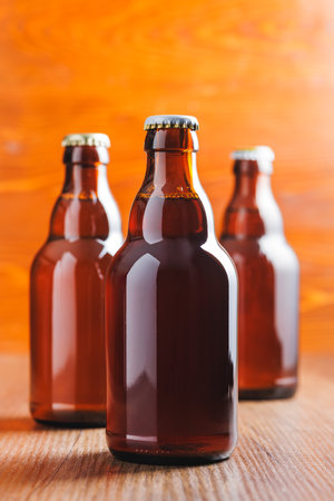 Bottles of beer on the wooden table.の写真素材