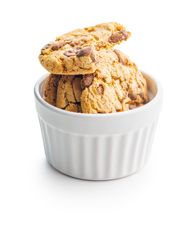 Sweet chocolate cookies in a bowl isolated on the white background.の写真素材