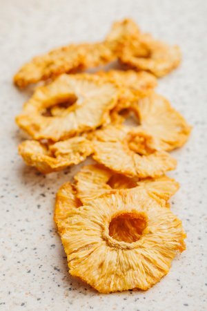 Dried pineapple rings on the kitchen table.の写真素材