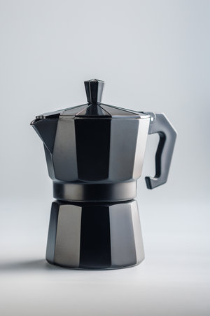 Bialetti mocha pot. Coffee maker on the gray background.の写真素材