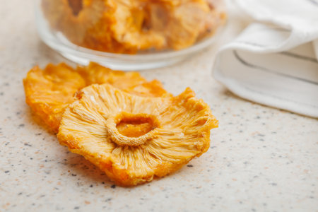 Dried pineapple rings on the kitchen table.の写真素材