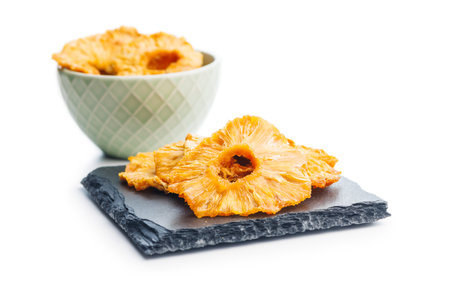Dried pineapple rings isolated on the white background.の写真素材