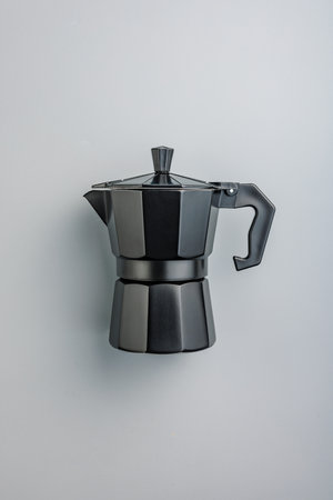 Bialetti mocha pot. Coffee maker on the gray background. Top view.の写真素材