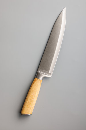 Kitchen knife on the gray background. Top view.の写真素材