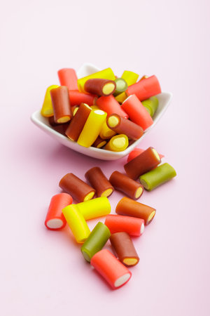 Colorful sweet jelly candies on the pink background.の写真素材