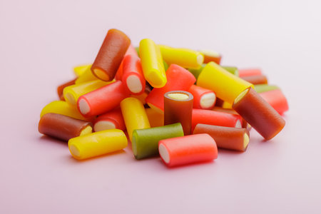 Colorful sweet jelly candies on the pink background.の写真素材