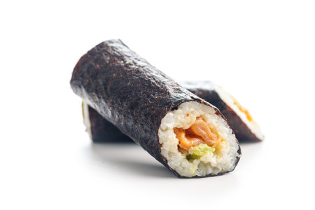 A detailed view of sushi rolls, showcasing the various colorful ingredients tightly wrapped in seaweed and rice, set against a plain white background.の写真素材