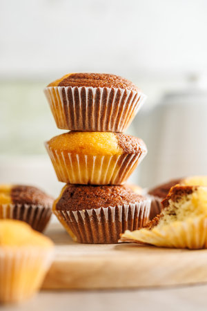 Close Up of a Muffins on a cutting board on a kitchen tableの写真素材