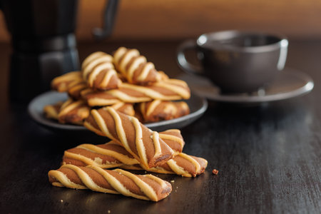 Classic Striped Cookies on a black table.の写真素材