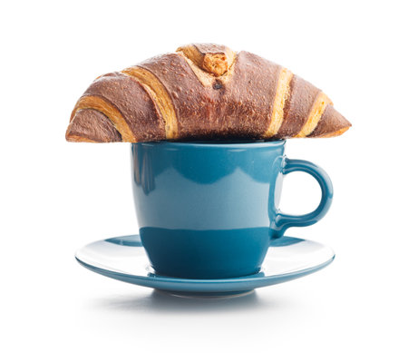 Fresh Chocolate Croissant With a Cup of Coffee on a White Backgroundの写真素材