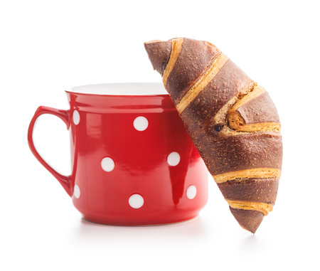 Fresh Chocolate Croissant With a Cup of Coffee on a White Backgroundの写真素材