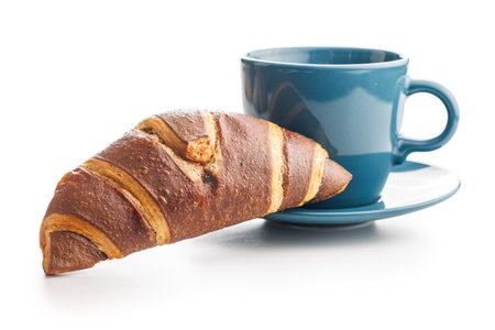 Fresh Chocolate Croissant With a Cup of Coffee on a White Backgroundの写真素材
