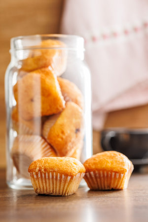 Magdalenas the typical Spanish plain muffins on a wooden table.の写真素材