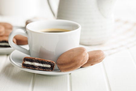 Freshly Brewed Coffee in Cup With Chocolate Cookies on a Saucerの写真素材
