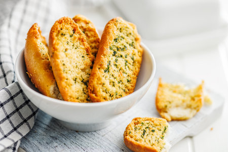 Garlic crisp bread Slices Topped With Herbs in a bowl.の写真素材