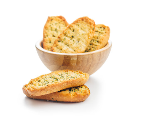 Garlic crisp bread Slices Topped With Herbs isolated on a white background.の写真素材