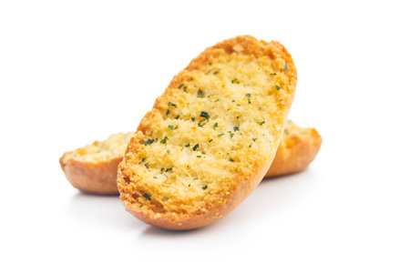 Garlic crisp bread Slices Topped With Herbs isolated on a white background.の写真素材