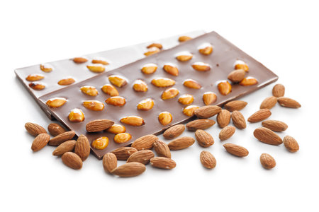 Chocolate bar with almonds isolated on a white background.の写真素材