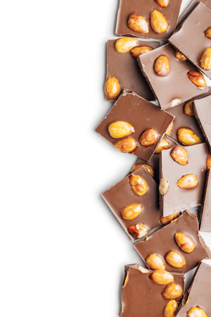 Broken chocolate bar with almonds isolated on a white background.の写真素材