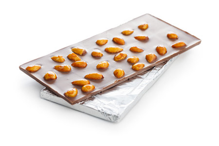 Chocolate bar with almonds isolated on a white background.の写真素材