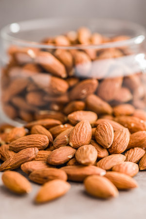 Peeled almond nuts on a kitchen table.の写真素材
