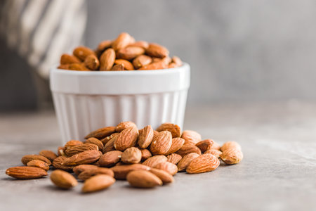 Peeled almond nuts on a kitchen table.の写真素材