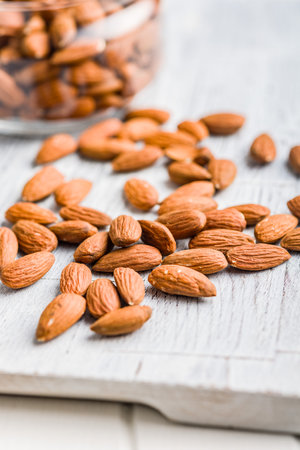 Peeled almond nuts on a kitchen table.の写真素材