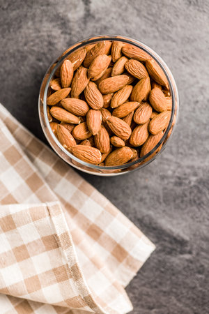 Peeled almond nuts in a bowl, Top view.の写真素材