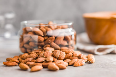 Peeled almond nuts on a kitchen table.の写真素材