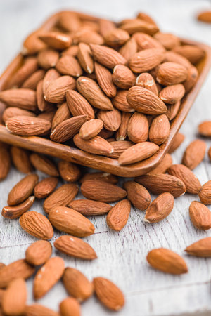 Peeled almond nuts in a bowl,の写真素材