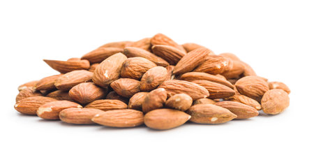 Peeled almond nuts isolated on a white background.の写真素材