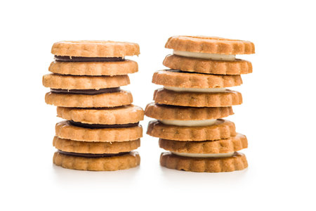 Sandwich Cookies with a cream filling isolated on a white background.の写真素材