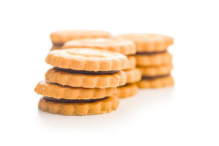 Sandwich Cookies with a cream filling isolated on a white background.の写真素材