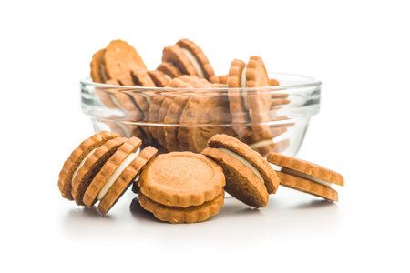 Sandwich Cookies with a cream filling isolated on a white background.の写真素材