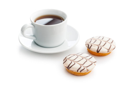 Sweet dessert with sugar coating and coffee cup isolated on a white background.の写真素材