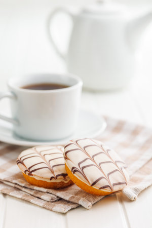 Sweet dessert with sugar coating on a white table.の写真素材
