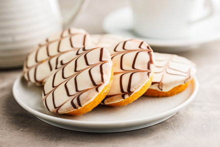 Sweet dessert with sugar coating on a plate on a kitchen table.の写真素材