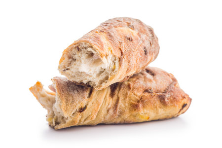 Crusty rustic baguette isolated on a white table.の写真素材