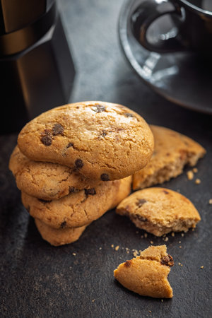Chocolate cookies on a black table.