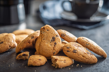 Chocolate cookies on a black table.の写真素材