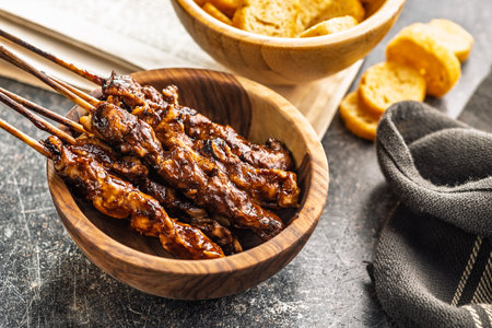 Japanese chicken yakitori in bowl on a black table.の写真素材