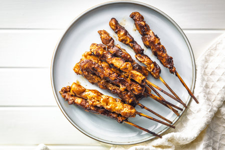 Japanese chicken yakitori on a plate on a white table. Top view.の写真素材