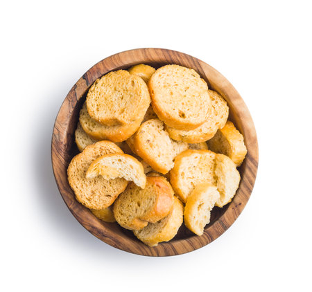 Sliced roasted bruschetta bread in bowl isolated on a white background.の写真素材