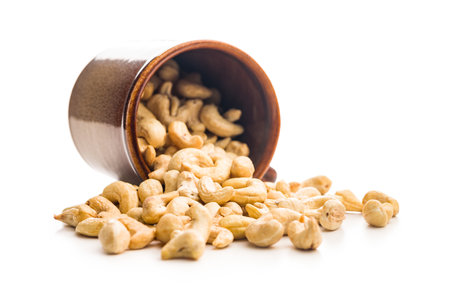 Roasted cashew nuts isolated on a white background.の写真素材