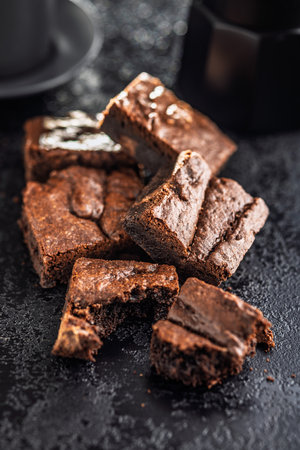 Homemade chocolate brownies on a black table.の写真素材