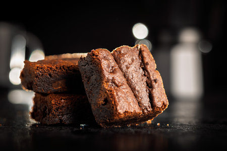 Homemade chocolate brownies on a black table.の写真素材